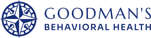 Goodman's Behavioral Health logo with blue compass, symbolizing guidance in mental health counseling.